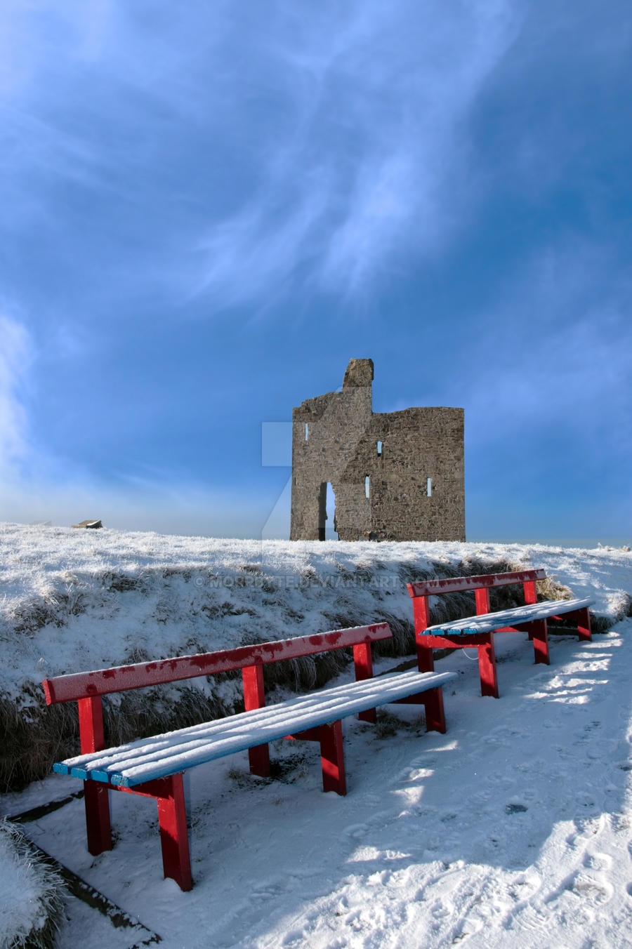 winter pathway to ballybunion castle and red bench