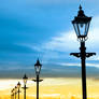 lighthouse and row of vintage lamps