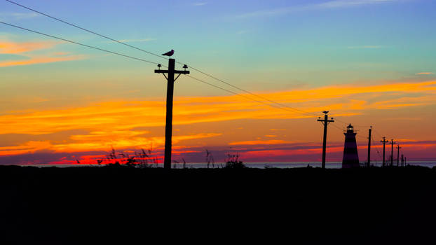 Sunset, Disney-coloured sky, lighthouse, seagulls