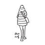 A woman walking down the street in winter