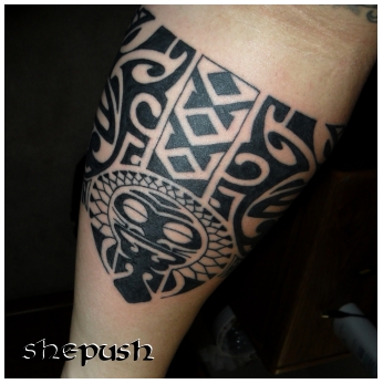 Lower arm tribal tattooed