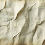 An aged, vintage paper texture with subtle creases