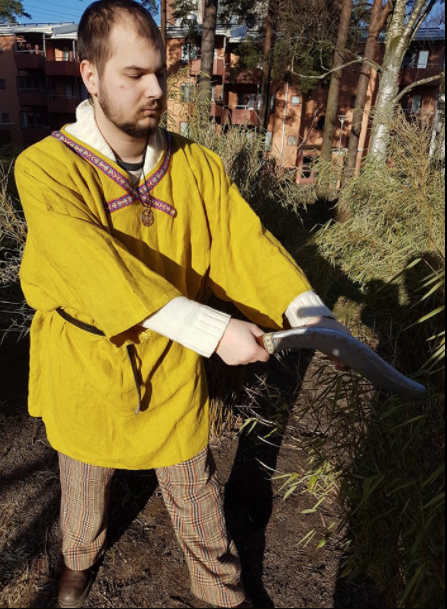 Celtic merchant cutting some material