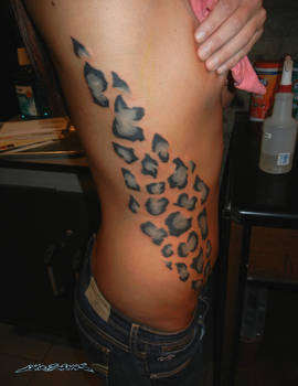 Snow Leopard Print Rib tattoo