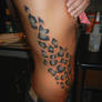 Snow Leopard Print Rib tattoo