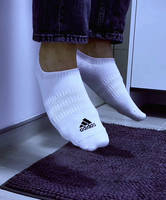white adidas ankle socks dangling