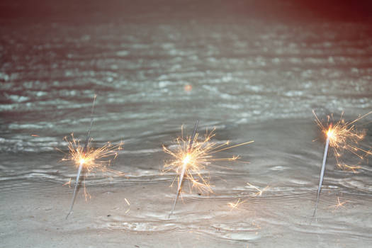 sparklers by the waves