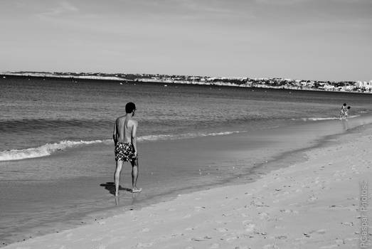 Man Walking on the Beach