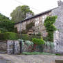 Stone Home with Hedge