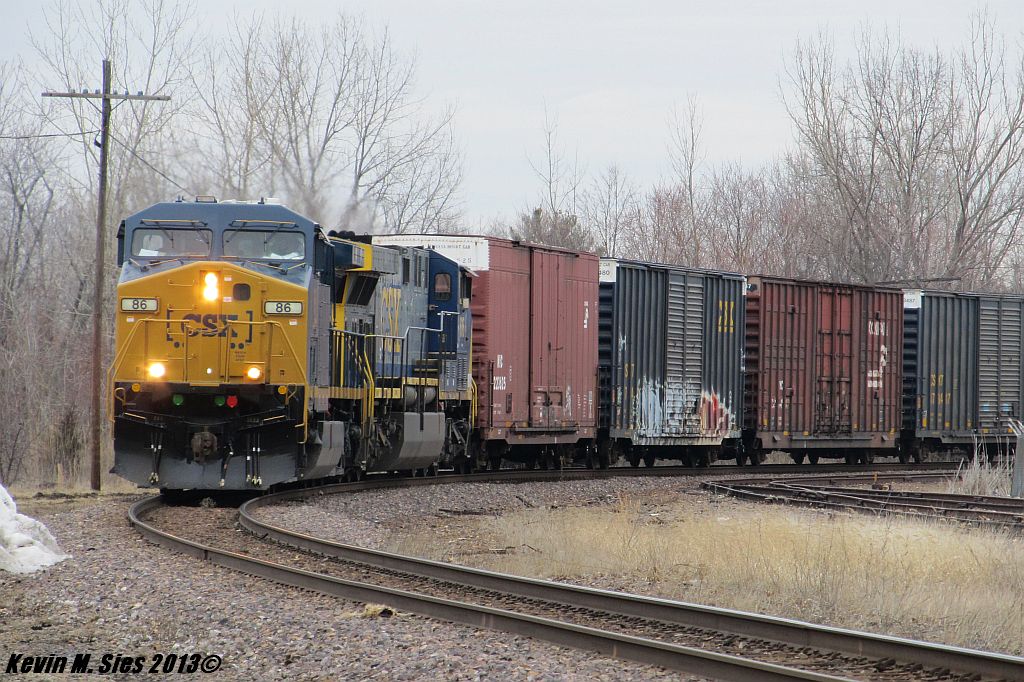 CSXT Q233 with fresh painted engine taking a curve