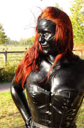 Redhead in black shiny bodypaint oil by chrischaaan