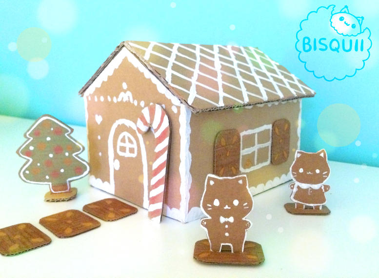 A charming gingerbread house made from cardboard, complete with intricate details and a festive appearance.