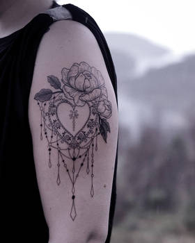 Unsymmetrical ornament tattoo