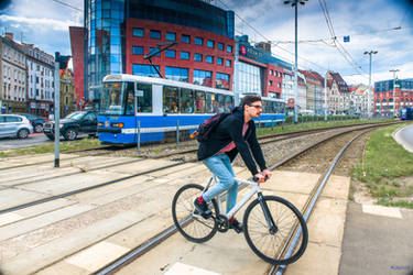 Biker and tram  by Rikitza