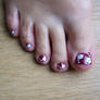 red and white flower toenail