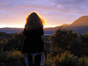 My sister taking a picture of the sunset by LeaTrekina