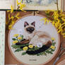 Siamese cat in blooming dandelions embroidery
