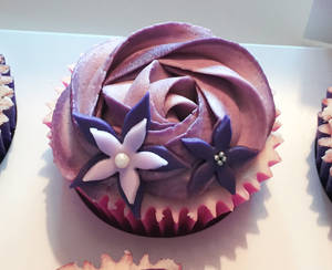 Purple swirl G.O.S.H charity cupcake