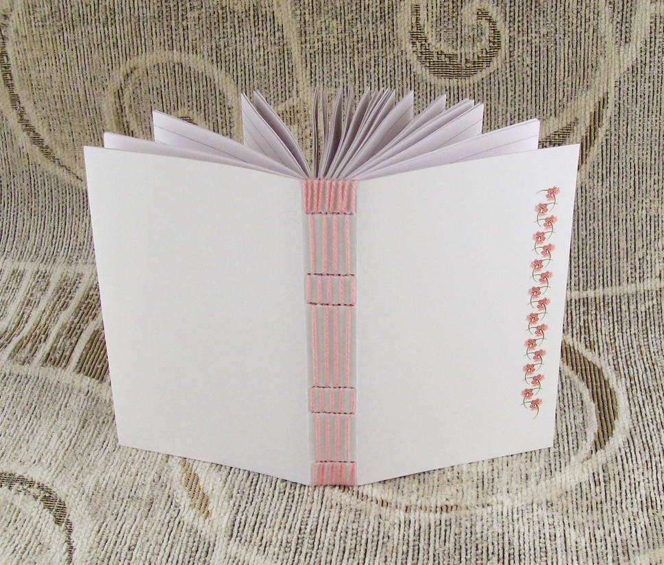 pink stitches, lined journal by yatsu
