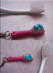 A toothbrush charm
