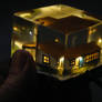 micro farm house embedded in clear resin with leds