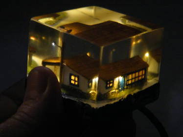 micro farm house embedded in clear resin with leds