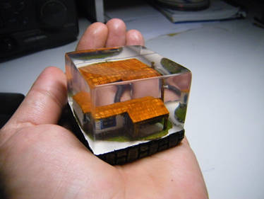 micro farm house embedded in clear resin with leds