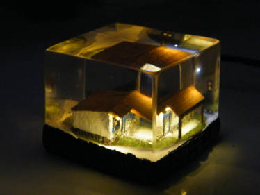 micro farm house embedded in clear resin with leds