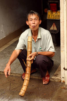 smoking a bamboo pipe