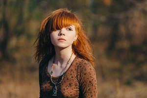 Beautiful young woman in the forest with flowers