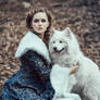 The woman in blue coat walk with a dog