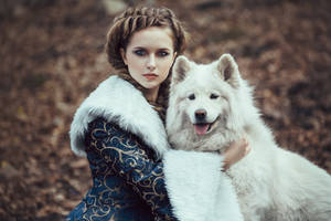 The woman in blue coat walk with a dog