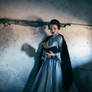 Woman in victorian dress imprisoned in a dungeon