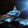 Beautiful lady in blue dress walking near sea