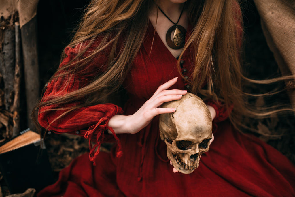 Witch holds the skull in hands by Black-Bl00d