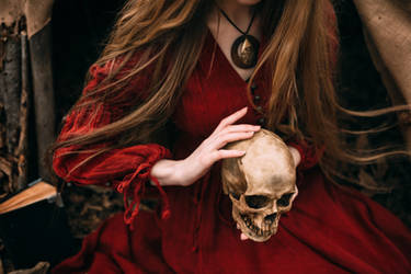 Witch holds the skull in hands