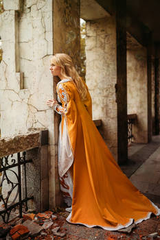 Beautiful lady with blond hairs in medieval dress