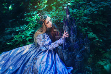 Princess in vintage dress walking in magic forest