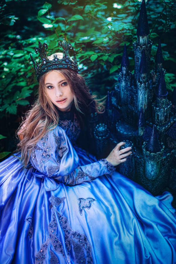 Princess in vintage dress walking in magic forest