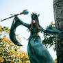 Woman-shaman with horns in  dress walk in forest