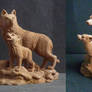 Wolf and cub: fossil carving