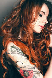 Redhead girl with tatoo