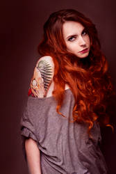 Redhead girl with tatoo