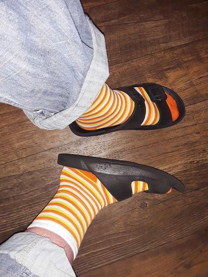 Black Flip Flops on Candy Corn Socks