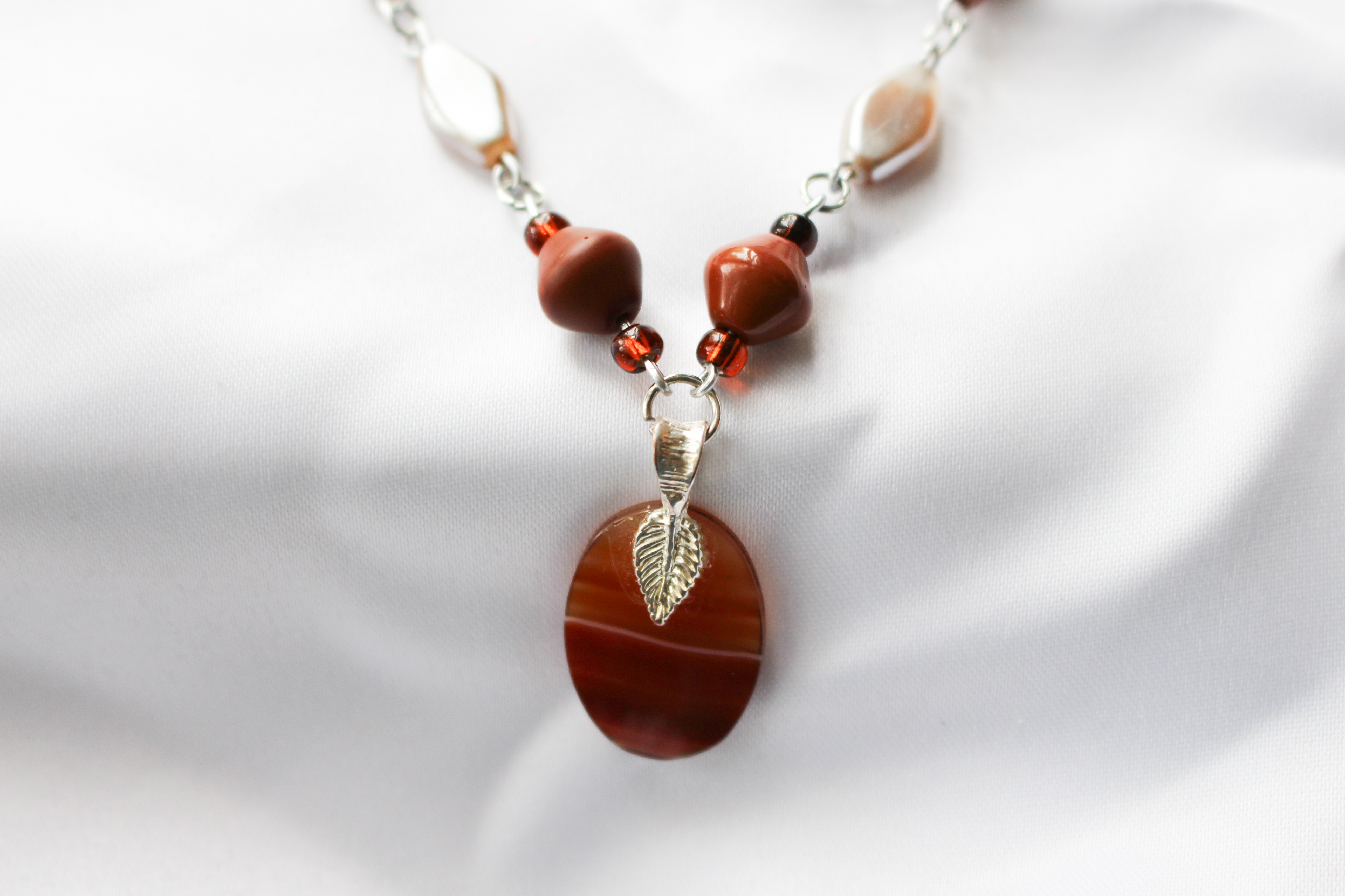 Orange Agate Pendant on SpiceColor Beaded Necklace