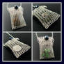 Wire knit pouch with crystal button