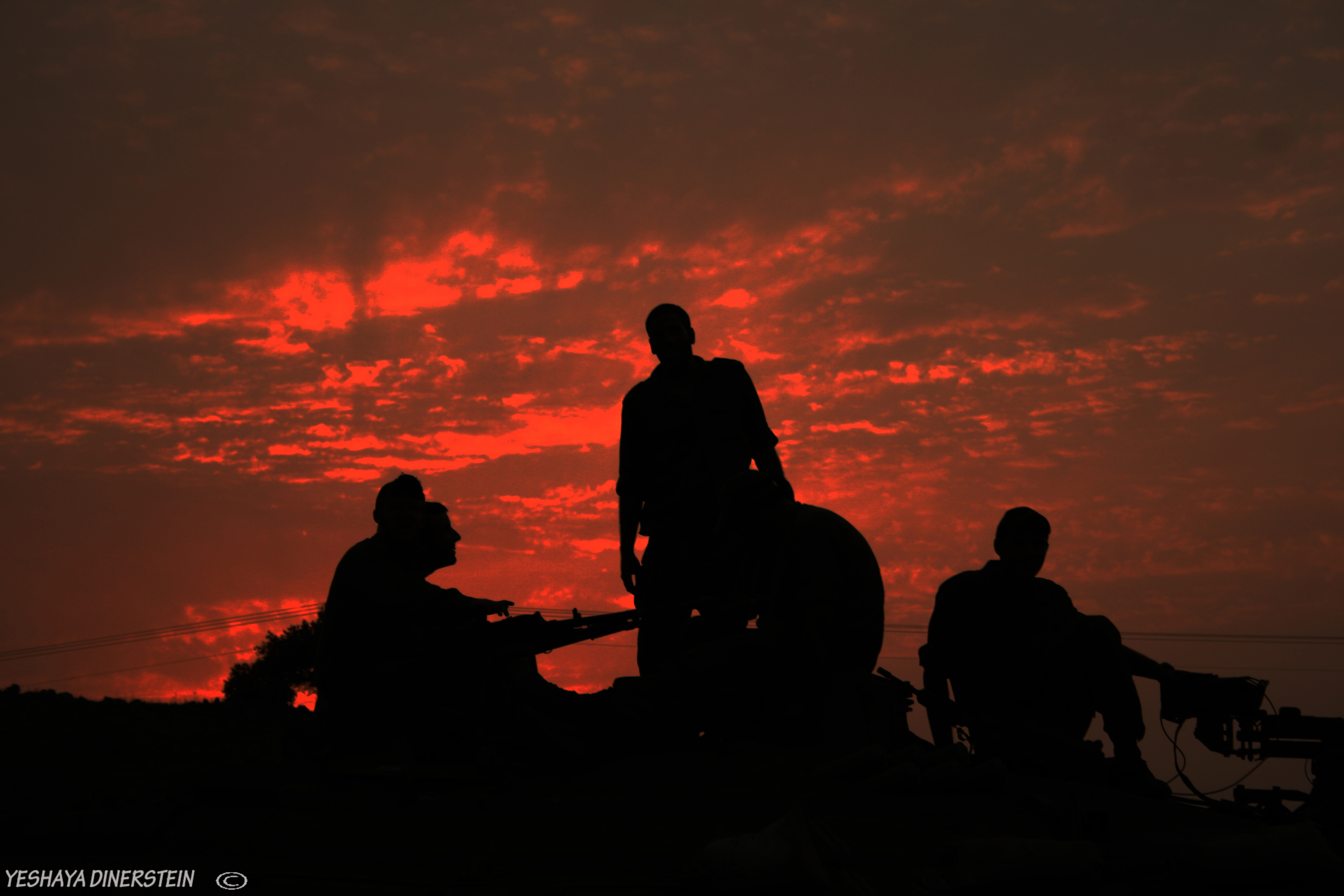 soldier on a tank sunset