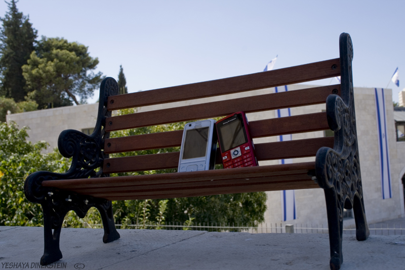 Pele-phones on  bench