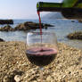 Red wine on the pebble beach