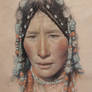 Portrait of the Tibetan girl wearing a headdress